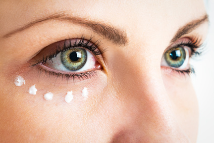 Caring for the skin around the eyes. Photo closeup.